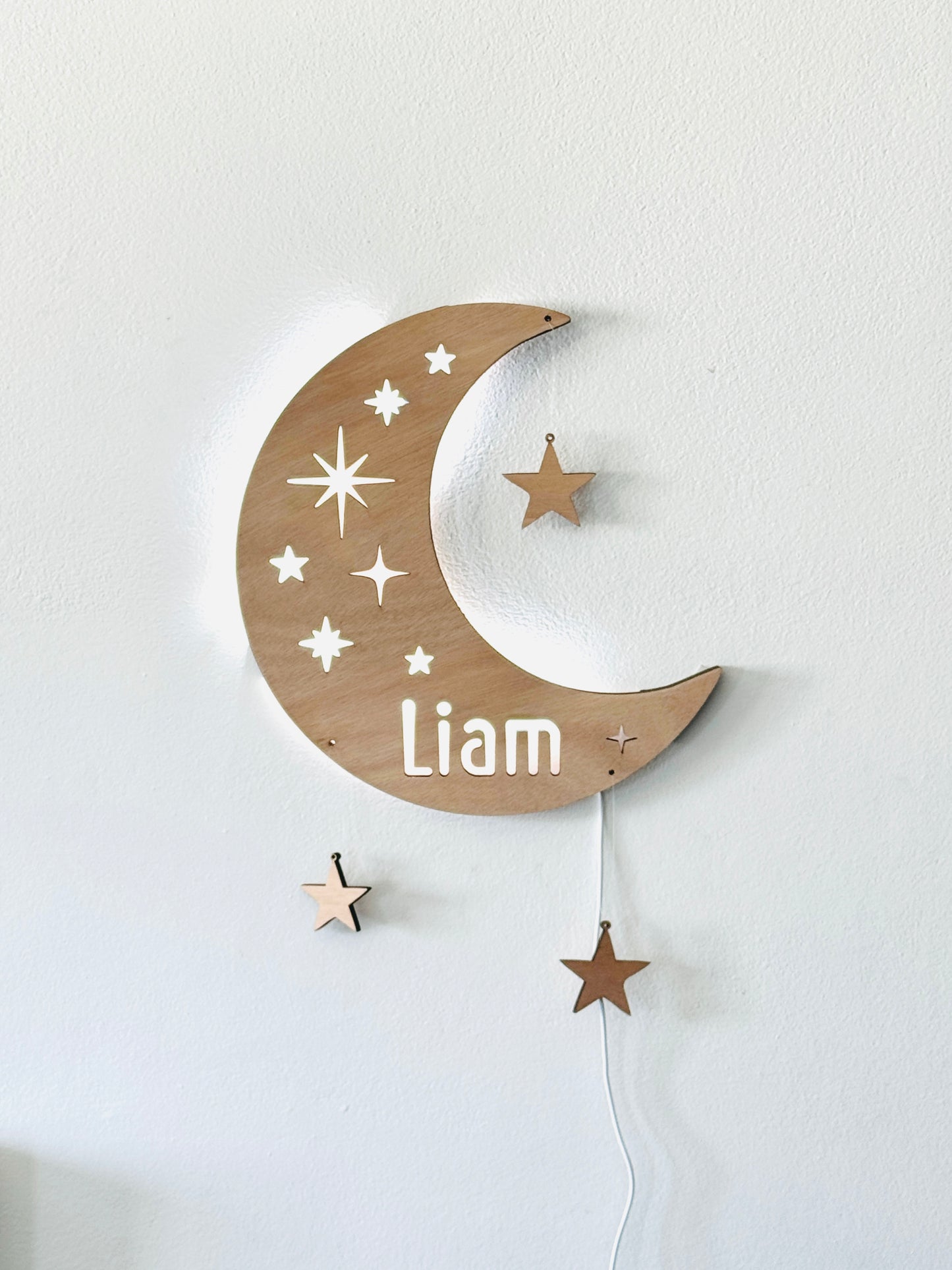 Personalized half moon LED wall light with name and hanging stars – perfect for nursery or kids’ room night light.