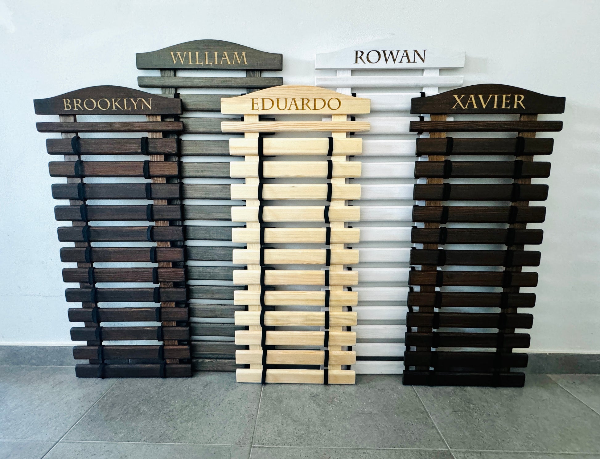 personalized wooden karate belt display racks with engraved names in multible colors