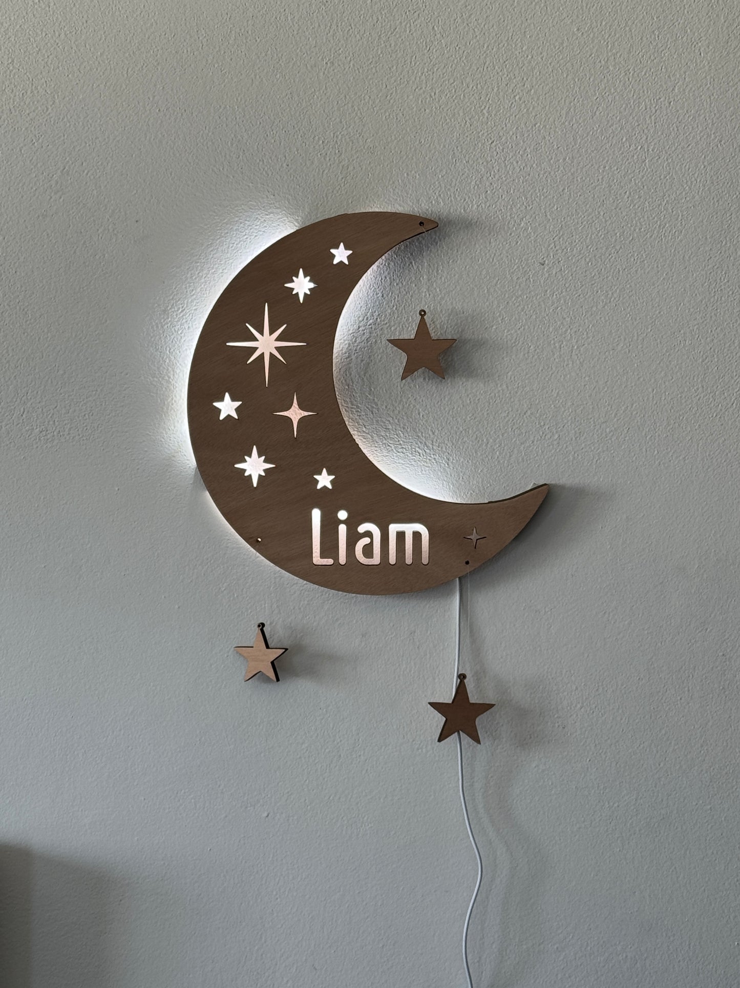 Personalized half moon LED wall light with name and hanging stars – perfect for nursery or kids’ room night light.