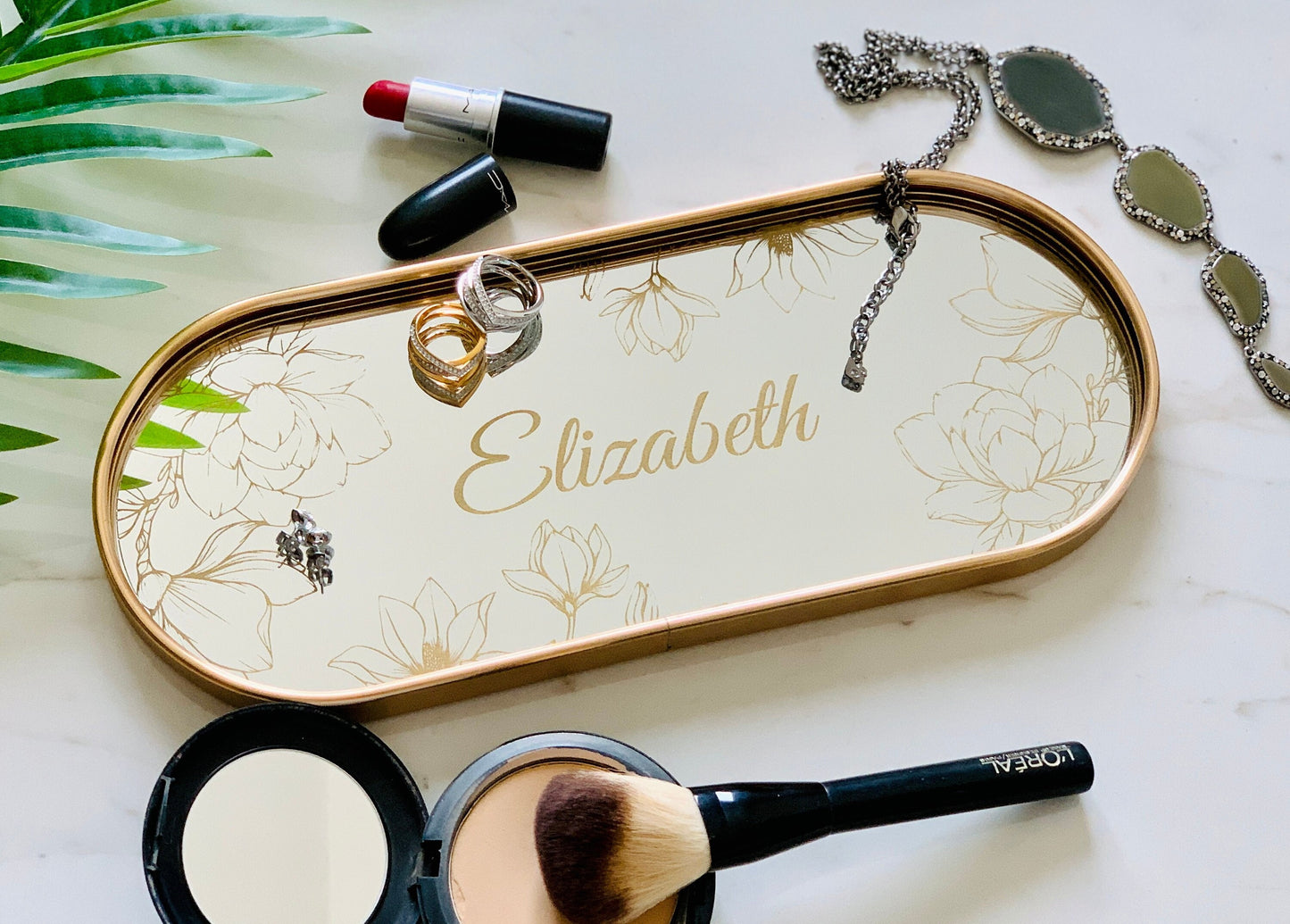Personalized oval gold jewelry mirror tray with engraved magnolia flowers and custom name, elegant vanity organizer for women