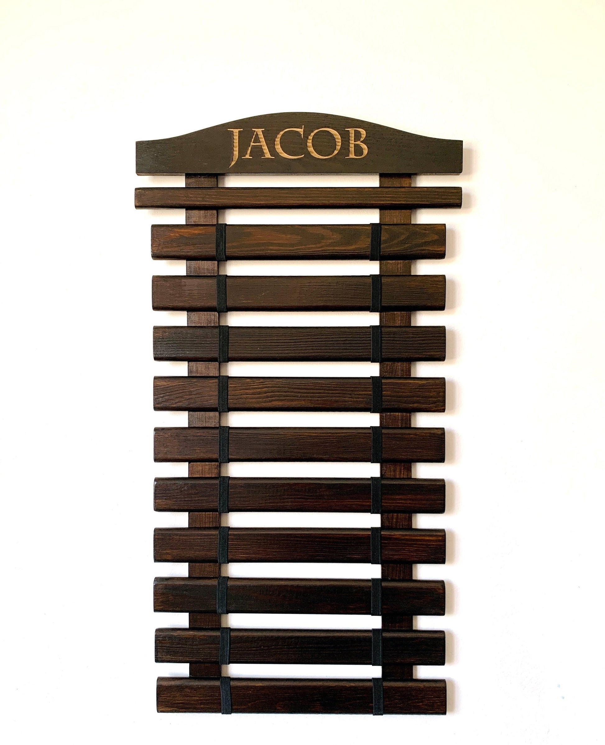 Personalized wooden martial arts belt display rack with engraved name, available in multiple colors and sizes (5-18 belts), perfect for Karate, Taekwondo, and Jiu-Jitsu practitioners.