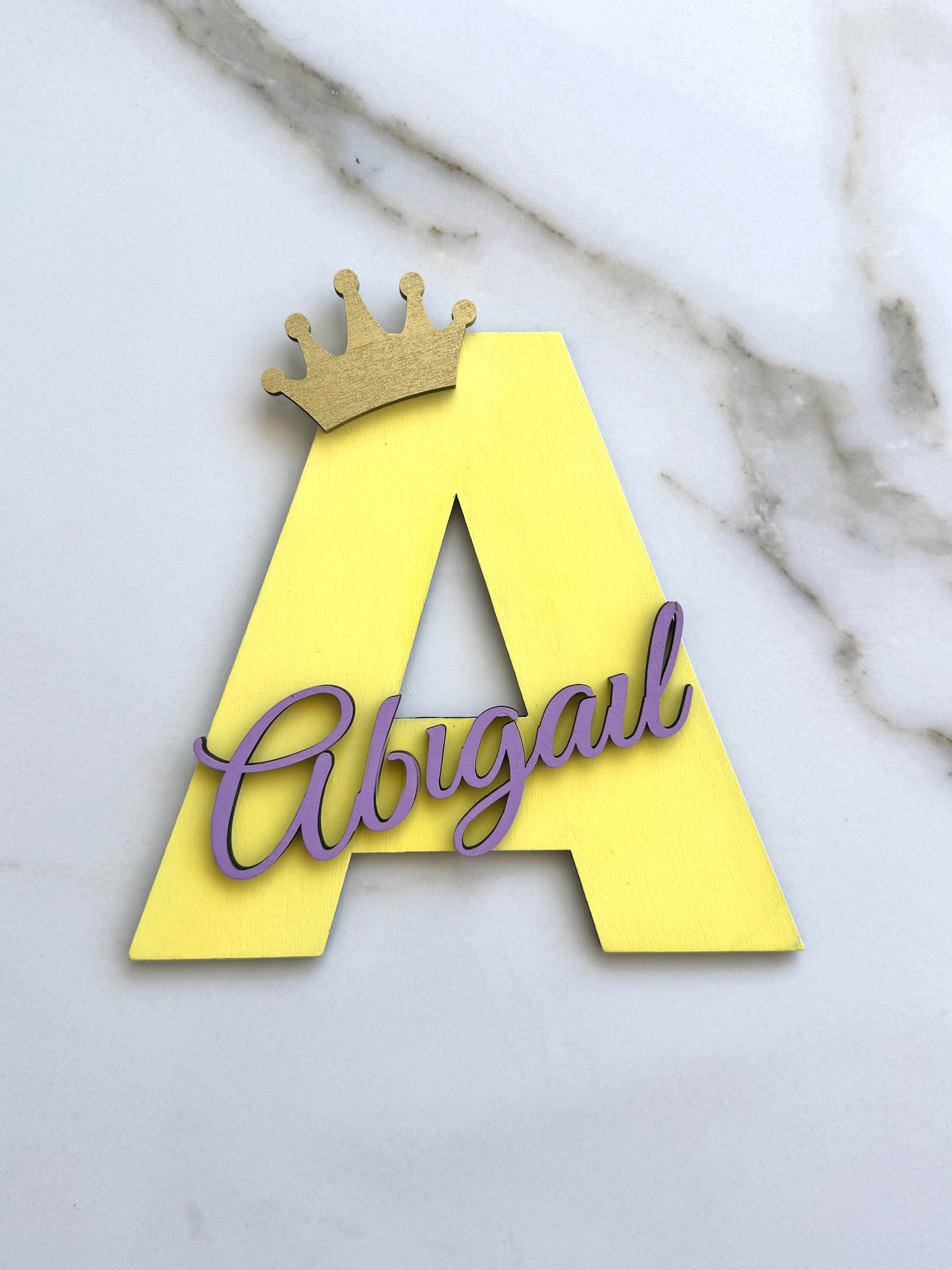 Personalized wooden Yellow initial letter with baby name in purple script, 20cm nursery wall decor with crown for girls room